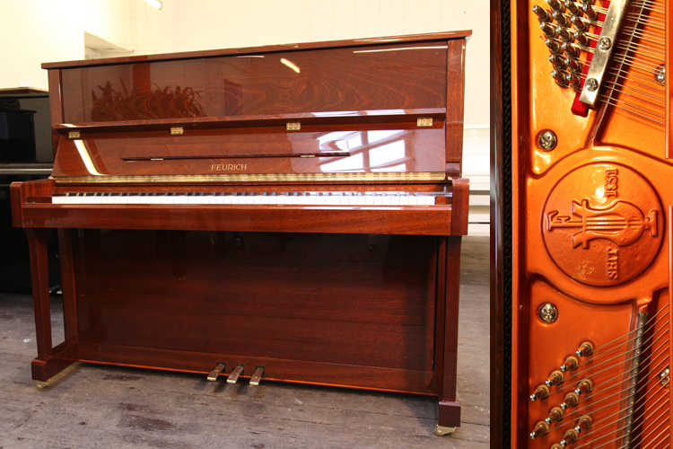 Brand new,   Feurich Model 122 upright piano with a walnut case