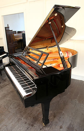 A brand new, Feurich Model 178 Professional grand piano with a black case and brass fittings