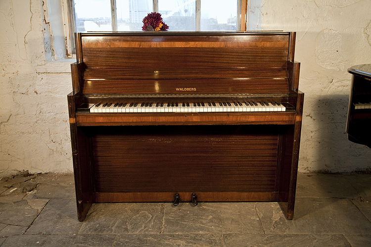 An Art Deco style, Waldberg upright piano with a mahogany case