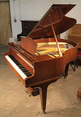 A 1970, Welmar baby grand piano with a mahogany case and square, tapered legs