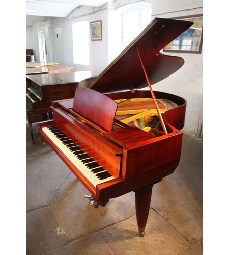 A 1955, Yamaha No20 grand piano with a satin, mahogany case. Piano features unusual, angular case styling