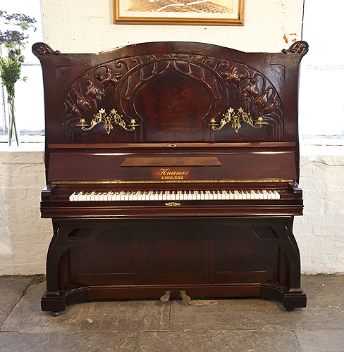 Piano for sale. A 1914, Art Nouveau, Knauss upright piano with a mahogany case with carved flowers and tendrils