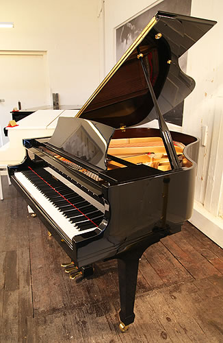 A secondhand, 2007, Essex EGP155 grand piano with a black case and polyester finish. Designed by Steinway and Sons