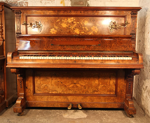 Goetze Upright Piano with a Burr  Walnut Case with Floral Inlaid Panels and Brass Candlesticks