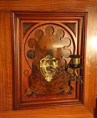 Schmidt carved panel and brass candlestick