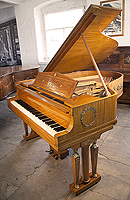 A 1919, Steinway Model O grand piano for sale with an Empire style mahogany case. Cabinet features ornate brass ormolu in Neoclassical and Egyptian motifs such as wreaths, winged lions and cabuchons. Legs feature cylindrical columns and female figures of victory on the capital 