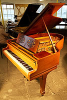 A 1921, Steinway & Sons Model O Grand Piano with a Walnut Case, Music Desk with Cut Outs in a Foliage Design  and Spade Legs