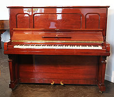 A 1925, Steinway model K upright piano with a polished, mahogany case 