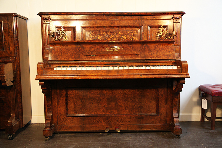 An 1894, Steinweg Nachf upright piano with a burr walnut case and floral inlaid panel