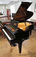 A 1925, Bechstein Model A1 grand piano with a black case and square tapered legs