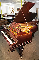 A Bechstein Model V grand piano with a rosewood case, filigree music desk and turned legs