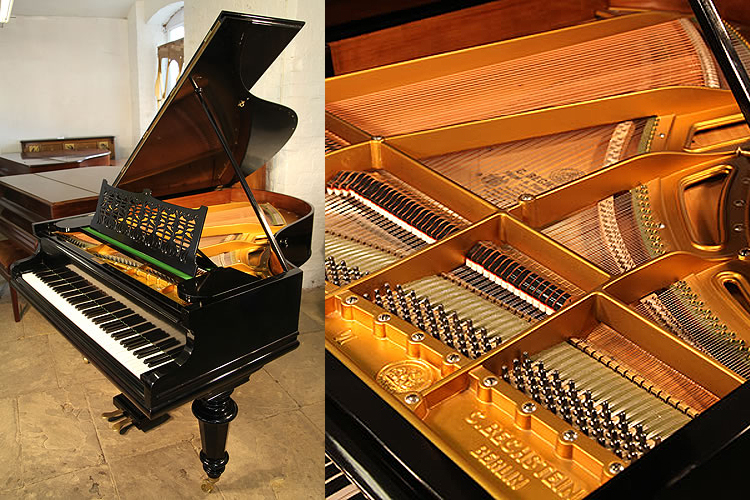 A Bechstein Model VI grand piano with a black case and turned legs