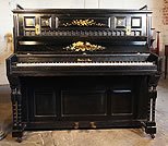 Piano for sale. A Challen upright piano with a black case