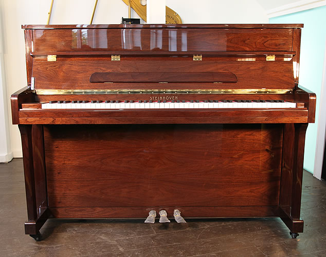 A brand new Steinhoven Model UP112 upright piano with a mahogany case