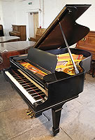 A 1901, Steinway Model A grand piano with a satin, black case and spade legs.