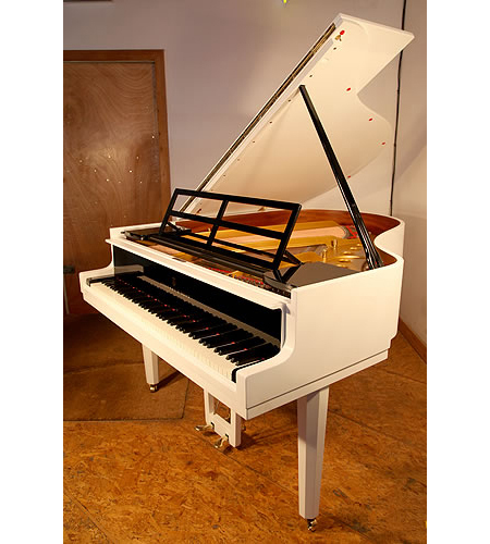 A 1966, Steinway Model M grand piano with a black and white case designed by Swedish Architect Ivar Tengbom