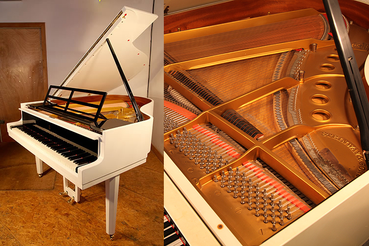 A Steinway Model M grand piano with a black and white case designed by Swedish Architect Ivar Tengbom