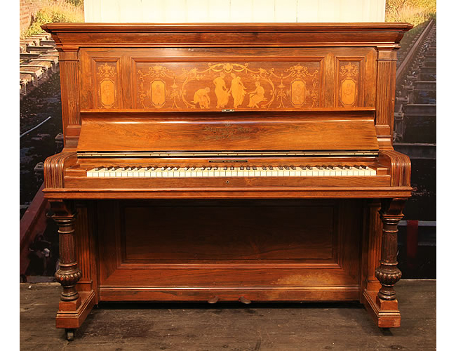 An 1894, Steinway Upright Piano For Sale with a Rosewood Case. Cabinet Features Inlaid Panels of Swags, Dancing Ladies and Cherubs