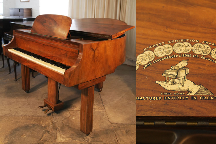 An Art Deco style Strohmenger baby grand piano with a walnut case