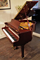 A Challen GP142 baby grand piano with a mahogany case and polyester finish