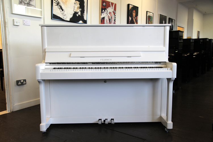 Brand new,   Feurich Model 122 upright piano with a white case