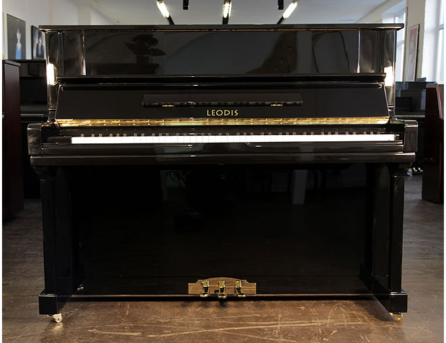 A Brand New Leodis 122 upright piano with a black case