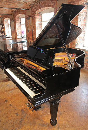 A rebuilt, 1901, Steinway Model A grand piano with a black case and spade legs