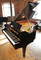 A 1999, Steinway Model A grand piano with a black case and spade legs. 