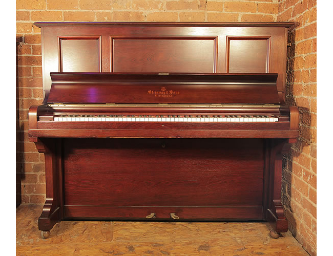 A 1906, antique Steinway Model K vertegrand upright piano with a rosewood case