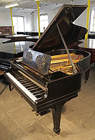 A 1920, Steinway Model O grand piano with an black case and cut-out music desk