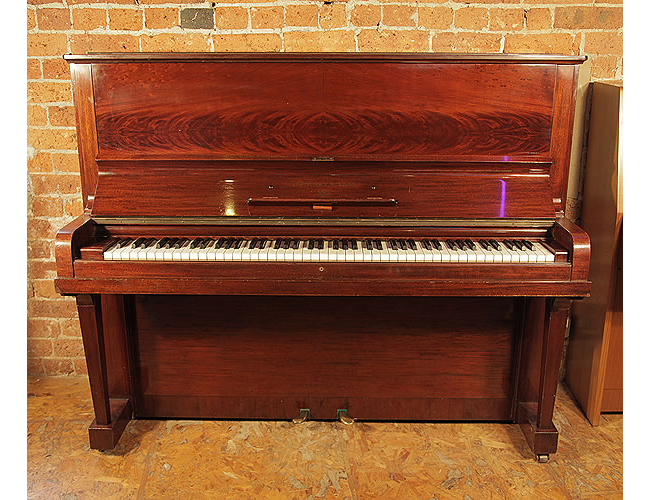 A 1935, Steinway Model V upright piano with a mirrored, mahogany case