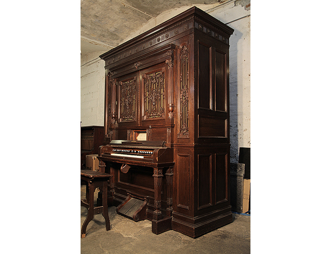 An Orchestrelle Co Self-Playing Harmonium with a Neoclassical style, Oak Case