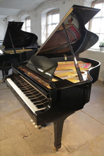A 1971, Yamaha C3 grand piano for sale with a black case and spade legs