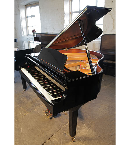 A 1995,Yamaha G1 baby grand piano for sale with a black case and spade legs