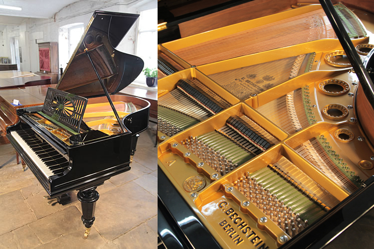 A restored, 1899, Bechstein Model A grand piano with a black case and turned legs