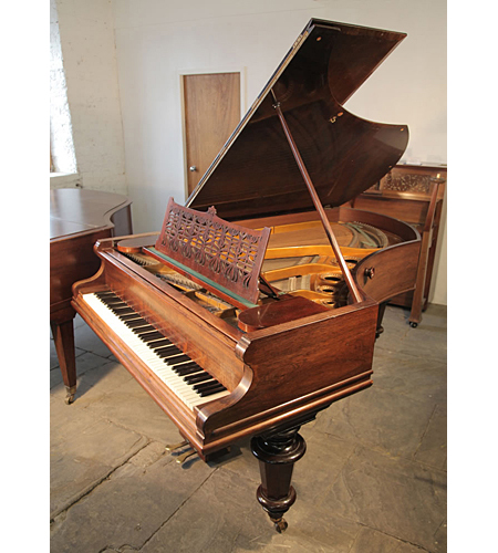 An 1896, Bechstein Model B grand piano with a polished, rosewood case and turned legs