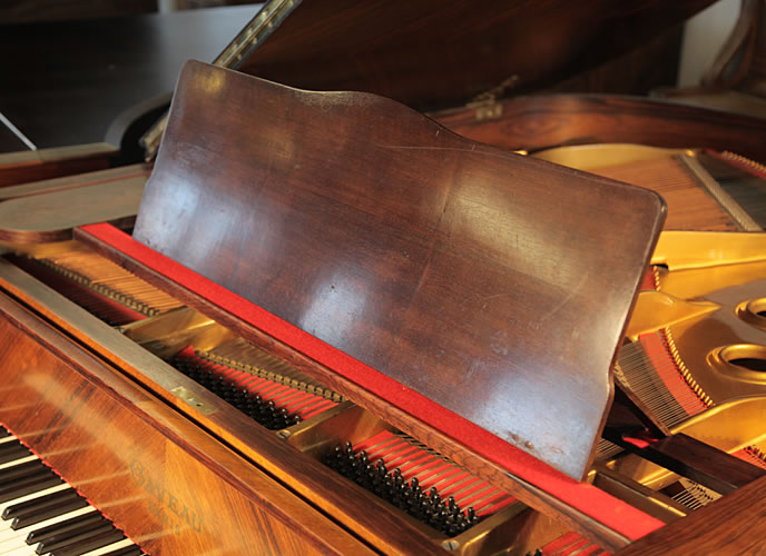 Gaveau grand piano for sale with a quartered, walnut case Gaveau