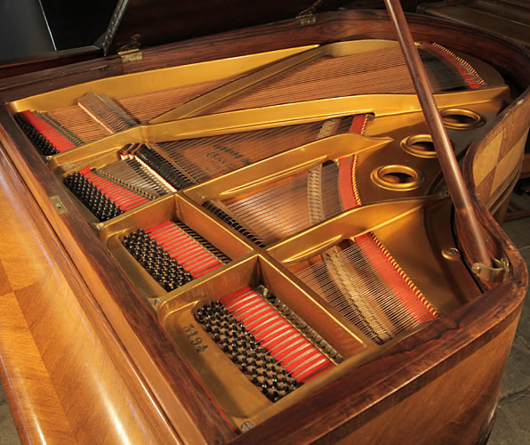 Gaveau grand piano for sale with a quartered, walnut case Gaveau
