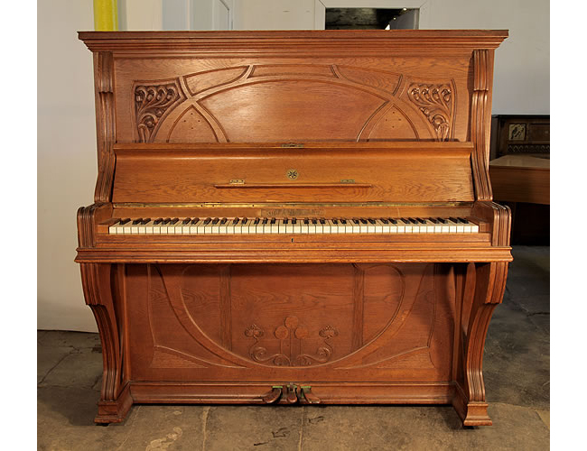 A 1905, Ibach upright piano with an Art Nouveau style, oak case