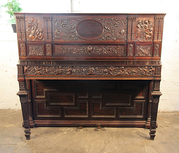 An 1880, Broadwood upright piano with a Neo-Renaissance style, Rosewood case. Entire Cabinet is Covered with Ornate High Relief Carvings.