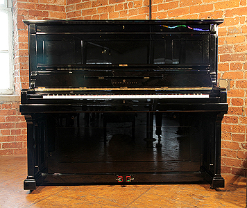 Steinway model K upright piano for sale.