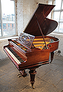A 1904, Bechstein Model A grand piano with a polished, rosewood case and turned legs