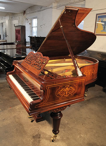 A Gebruder Knake Grand Piano with a Beautifully, Inlaid Rosewood Case. Cabinet Features Panels Inlaid with Musical Instruments, Flowers, Foliage and Scrolling Acanthus in a Variety of Woods