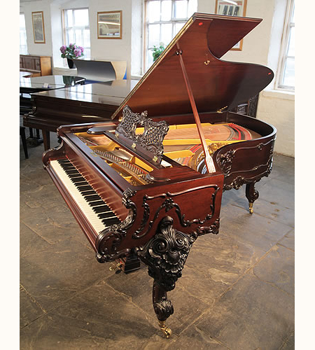 A 1911, Rococo style, Schiedmayer Model 3 Grand Piano with an ornately carved, mahogany case and cabriole legs