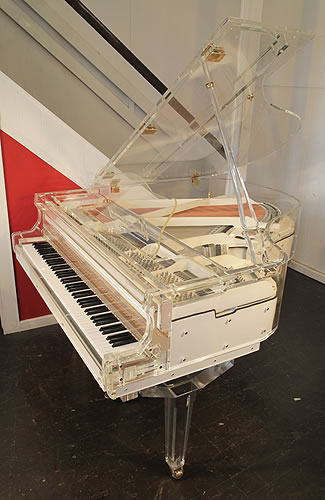 A brand new Steinhoven  grand piano with a transparent, acrylic case