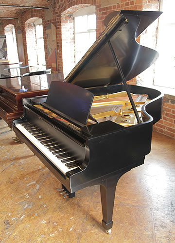 A 1942, Steinway Model A grand piano with a satin, black case and spade legs