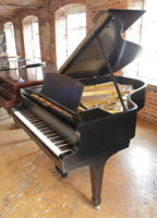 A 1942, Steinway Model A grand piano with a black case and spade legs. The first Steinway to come out of the Hamburg factory post WWII. 