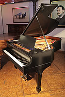A 1926, Steinway Model L grand piano with a satin, black case and chrome fittings. 