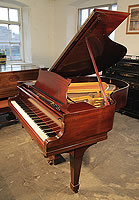 A 1927, Steinway Model M grand piano with a mahogany case and spade legs