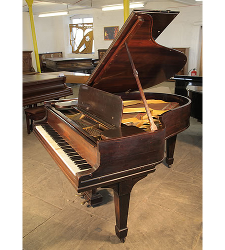 An unrestored, 1901, Steinway Model O grand piano with a rosewood case and spade legs. 